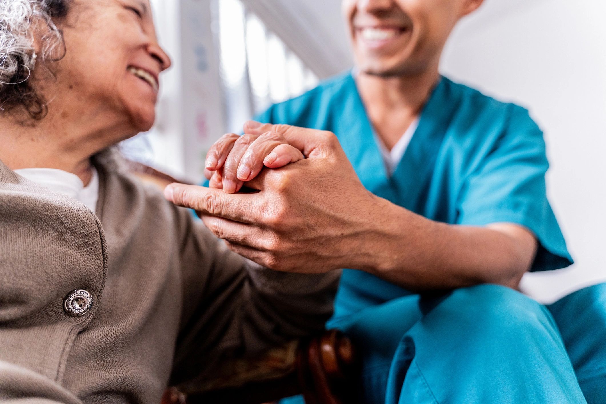 Caregiver supporting a senior patient at home