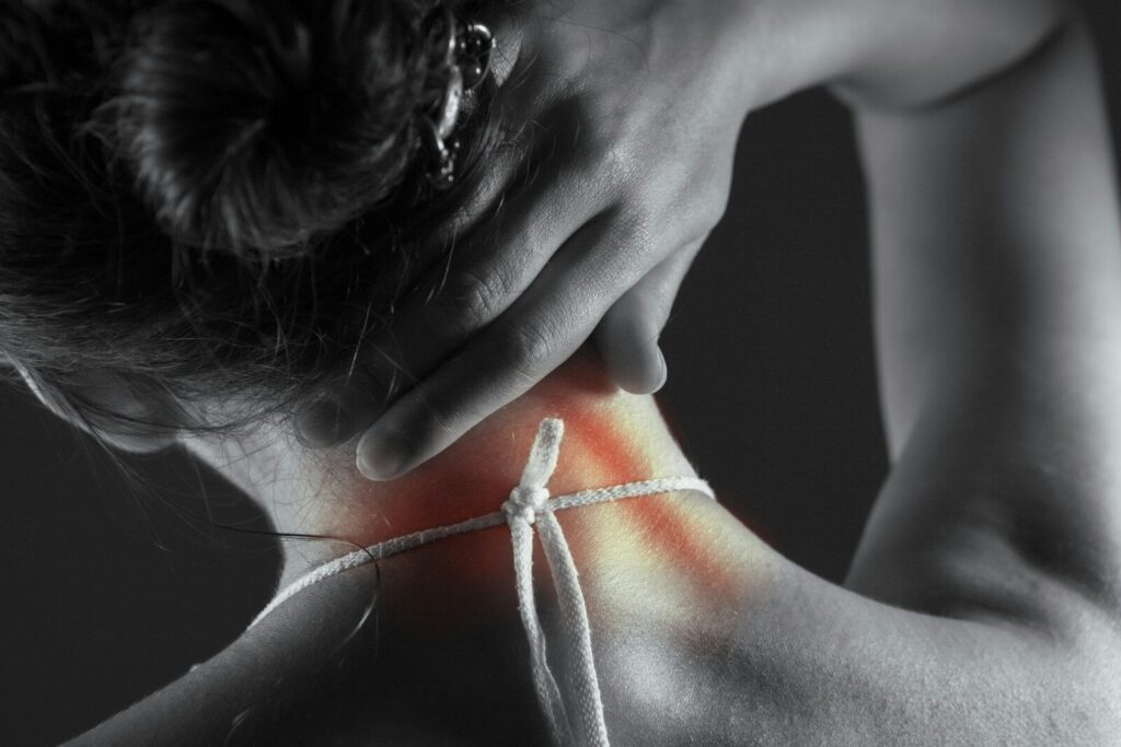 Woman's neck with highlighted pain area.